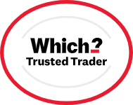 A white oval badge with a red outline features the text "Which? Trusted Trader" in bold black and red letters, highlighting recognition for expert joinery and carpentry services in Perth.